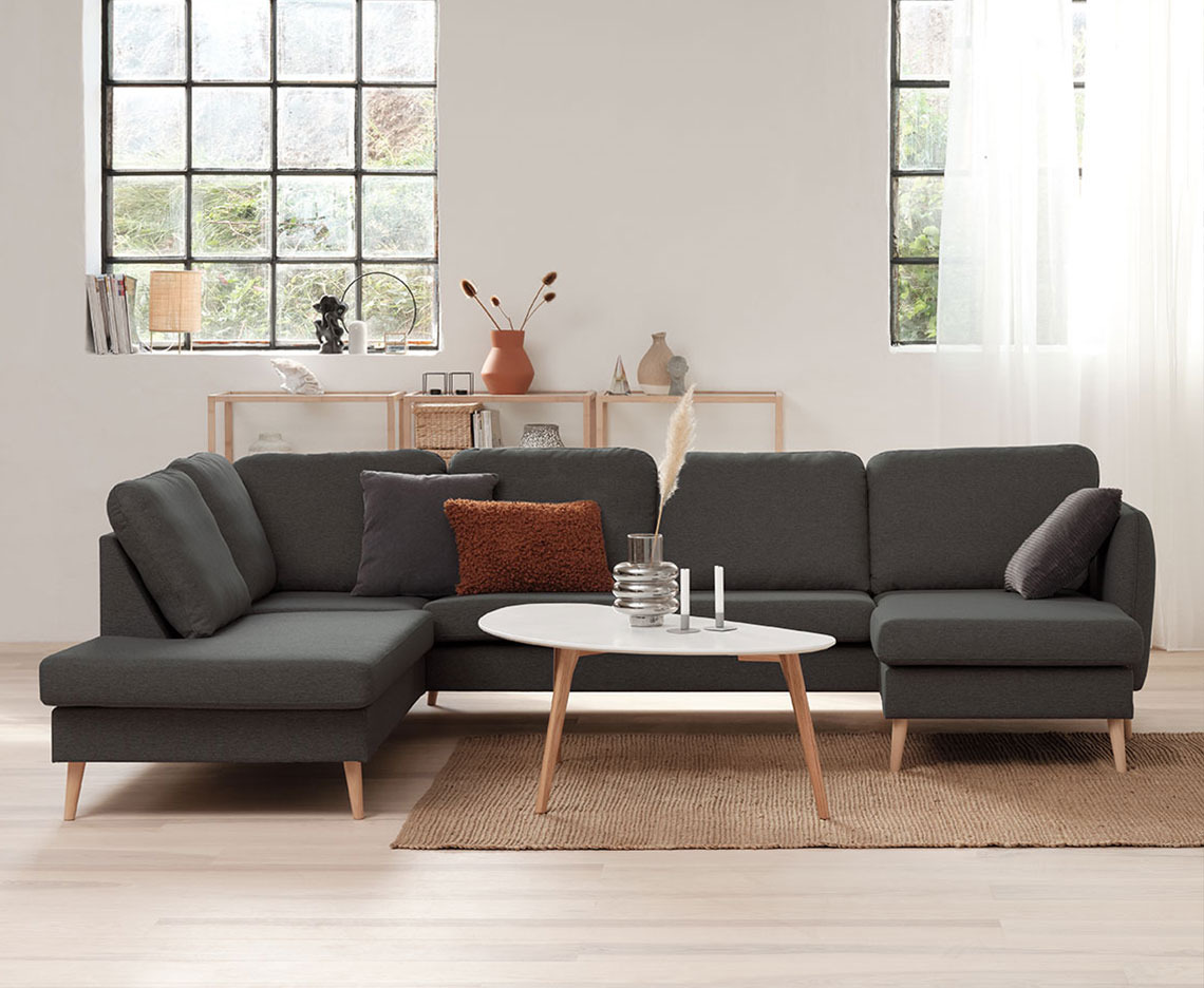 AARHUS corner sofa Dark grey corner sofa in a bright room with big windows