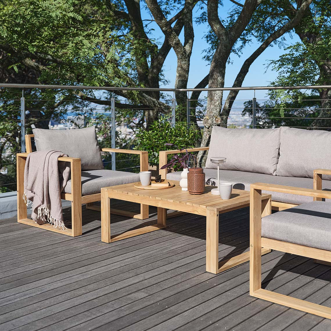 Large outdoor lounge set on patio made with FSC® solid teak